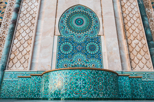 Beautiful fountain at the mosque Hassan II, water tap decorated with colorful shapes of mosaic - Casablanca, Morocco