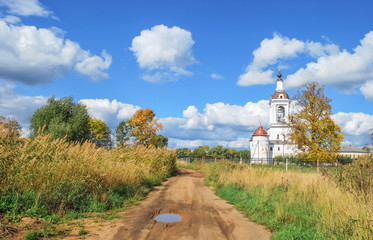 Provincial autumn landscape with  white Orthodox church