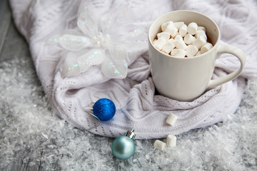 Obraz na płótnie Canvas Cup of cacao with marshmallow on Christmas wooden background