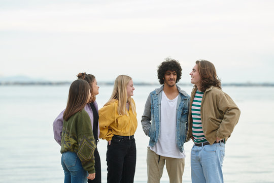 Five best friends together near lake.