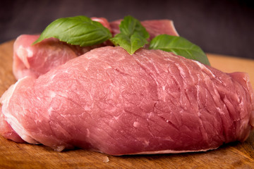  raw pork on a wooden board