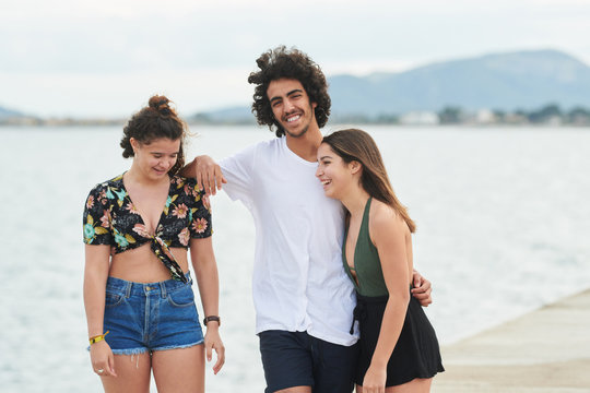 Teenage friends having fun at pier