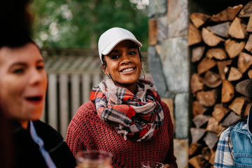 Smiling woman portrait taking with friends