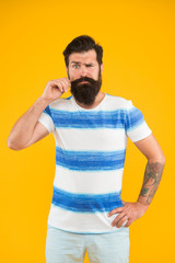 Time to get refreshed. marine style. bearded man hipster yellow wall. mature brutal guy striped...