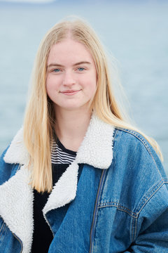 Pretty blonde teenager girl with long hair.
