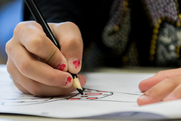 Kids learning and writing in school.