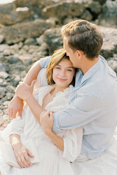 young couple hugging on the seashore