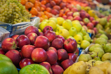 Fruit market with various colorful fresh fruits and vegetables
