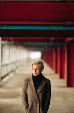 Portrait Of Young Blond Androgyne Woman On The Street