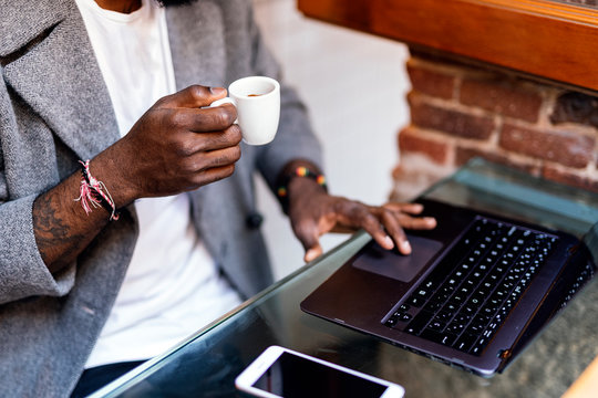 Close up of african man using computer