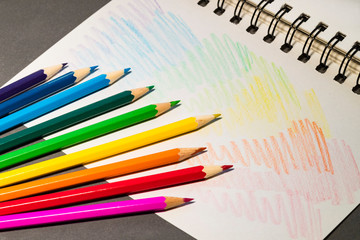 Background of stationery items notepad pencils shot closeup.