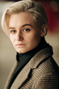 Portrait Of Young Blond Androgyne Woman On The Street