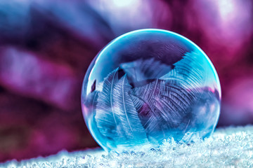 Colourful frozen soap bubble