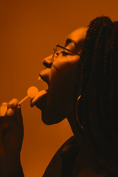 Teenage orange portrait in studio.