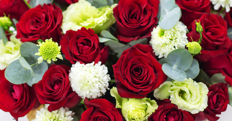 red roses on a white background composition of red roses in a basket