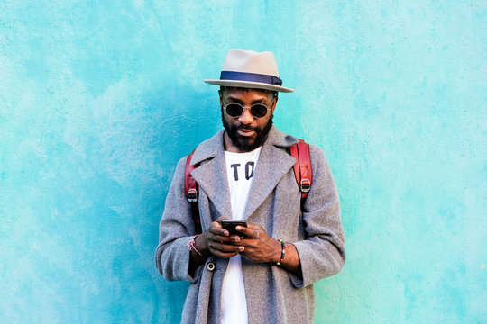 African man using mobile phone - Powered by Adobe