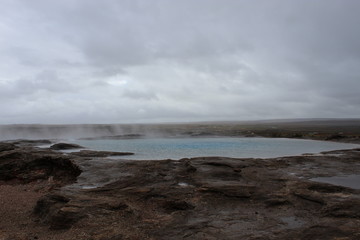 The original geysir in Iceland on a cloudy day