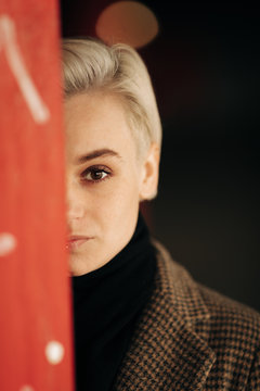 Portrait Of Young Blond Androgyne Woman On The Street
