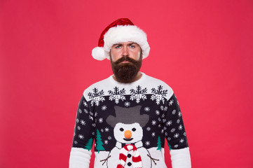 Knitted accessories. Winter weather style. Winter collection. Warmth and comfort. Cold winter conditions. Handsome bearded man wear jumper with snowman pattern red background. Winter sweater