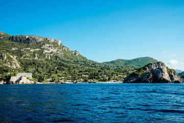 Obraz premium Paleokastritsa, Greece, 2018-09-03: Hilly coastline of Corfu island.