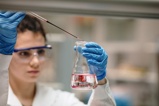 young woman doing chemical experiments