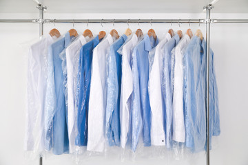 Rack with clothes in modern dry-cleaner's