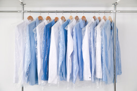 Rack with clothes in modern dry-cleaner's