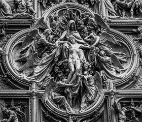 Milan Cathedral wall details in Italy, known as Duomo di Milano is the largest and most complex...
