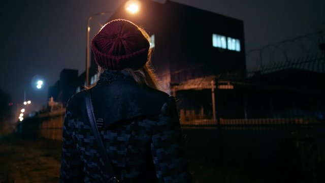 silhouette girl standing near the backyard of a polluting factory