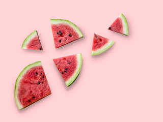 Composition of watermelon on a pink background. Flat lay, top view, copy space. Minimum summer concept.