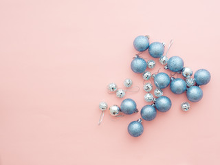 Silver Christmas balls on pink background