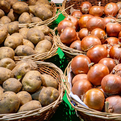 baskets with potatoes and onions