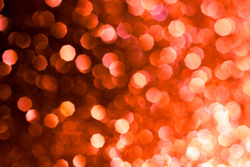 Abstract Christmas lights bokeh background image toned red color