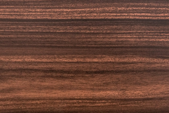 Texture of a wooden surface or board brown or chestnut color for background