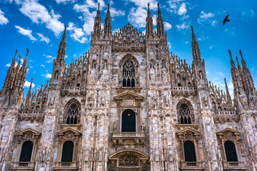 Fototapeta premium Milan Cathedral in Italy, known as Duomo di Milano is the largest and most complex Gothic building in Italy. Catholic church made of white marble.
