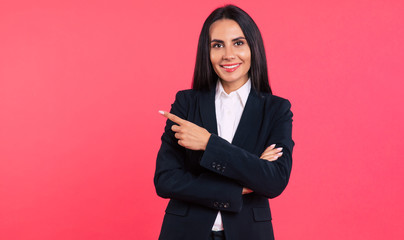 Look what I did! Close-up photo of a stunning young woman in a smart outfit, who is posing with...