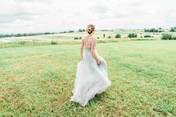 bride in a field 