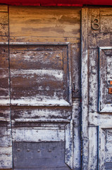 Texture of an old door. Fragment of a beautiful antique door. Vintage background.