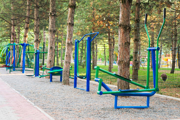Exercise stations in public park. Free outdoor gym. Close up outdoors gym equipment at the park...