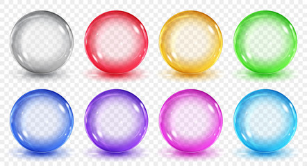 Set of translucent colored spheres with shadows on transparent background. Transparency only in vector format