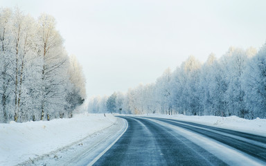 Winter road with snow in Finland. Cold landscape of Lapland. Europe forest. Finnish City highway...