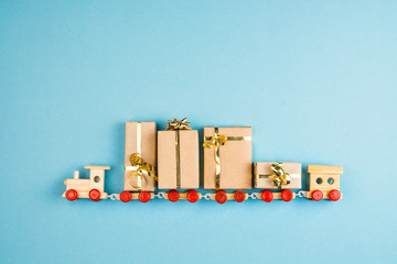 toy train filled with christmas presents on blue - New Year Merry Christmas card celebration old...