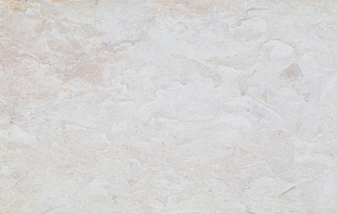 Close-up of a pale stone wall or slab. High resolution abstract full frame textured background.