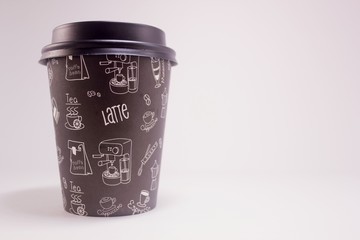 Paper Cup with coffee on a white background, copy space