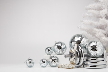 Dumbbell and Christmas ornaments. Fitness New Year and Christmas background
