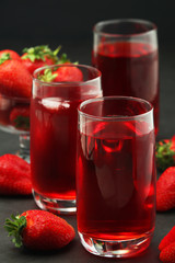 Glasses with strawberry drink with ice