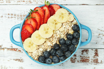 Healthy diet breakfast including cereal with berry and fruits	
