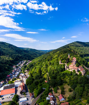Aerial view of Zwingenberg Castle on mountain against blue sky in town, Hesse, Germany