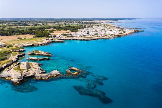 Aerial view of Roca Vecchia against clear sky during sunny day, Apulia, Italy