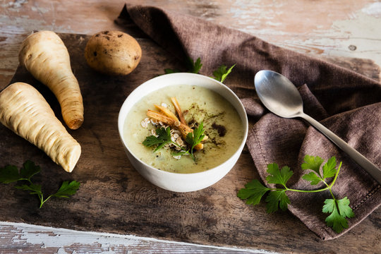 High angle view of oats soup served with ingredients on wooden table
